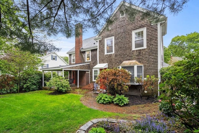 9 Palmer Rd, Marblehead, MA 01945 - back of property with a yard and a chimney