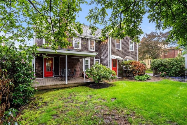 9 Palmer Rd, Marblehead, MA 01945 - rear view of house featuring a yard and a deck