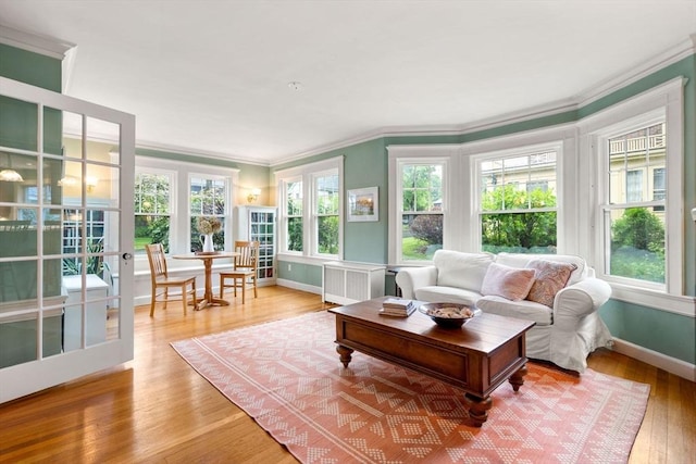 9 Palmer Rd, Marblehead, MA 01945 - sunroom featuring french doors, plenty of natural light, and radiator heating unit