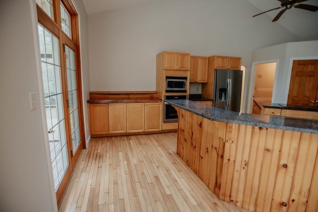 251 Butterworth Rd, Barre, MA 01005 - kitchen with appliances with stainless steel finishes, light wood finished floors, a ceiling fan, light brown cabinetry, and dark stone counters