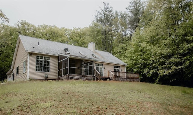 251 Butterworth Rd, Barre, MA 01005 - back of house with a sunroom, a chimney, a wooden deck, a lawn, and view of wooded area