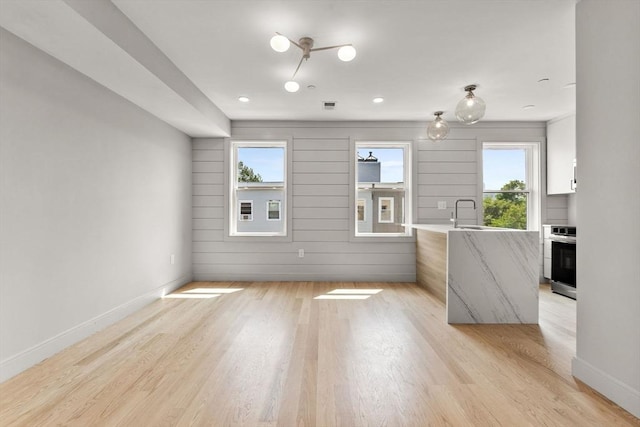 88 Maverick St Unit 3, Boston, MA 02128 - unfurnished living room featuring plenty of natural light and light wood-style flooring