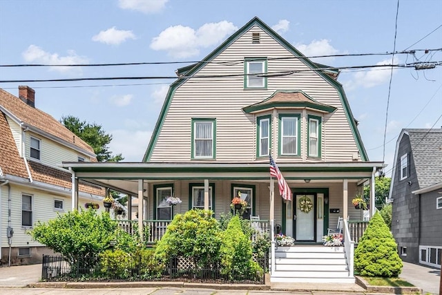 16 Pacific St, Lynn, MA 01902 - view of front facade with covered porch and a gambrel roof