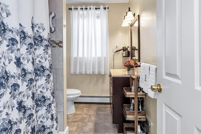 16 Pacific St, Lynn, MA 01902 - full bathroom with baseboard heating, vanity, and a shower stall
