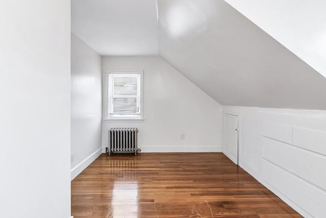 16 Pacific St, Lynn, MA 01902 - bonus room featuring radiator, wood finished floors, and vaulted ceiling