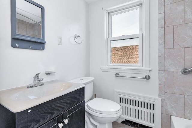 16 Pacific St, Lynn, MA 01902 - full bath featuring radiator heating unit, vanity, a shower, and a tub to relax in