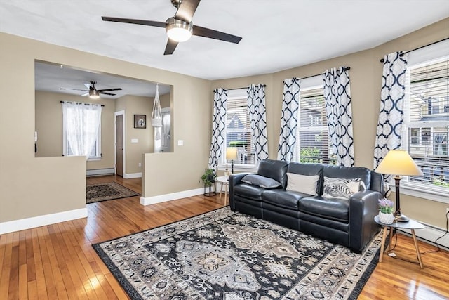 16 Pacific St, Lynn, MA 01902 - living area with a baseboard radiator, ceiling fan, and hardwood / wood-style floors
