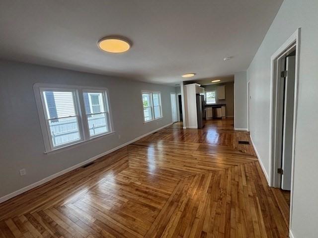 404 Brayton Ave, Fall River, MA 02721 - unfurnished living room featuring baseboards