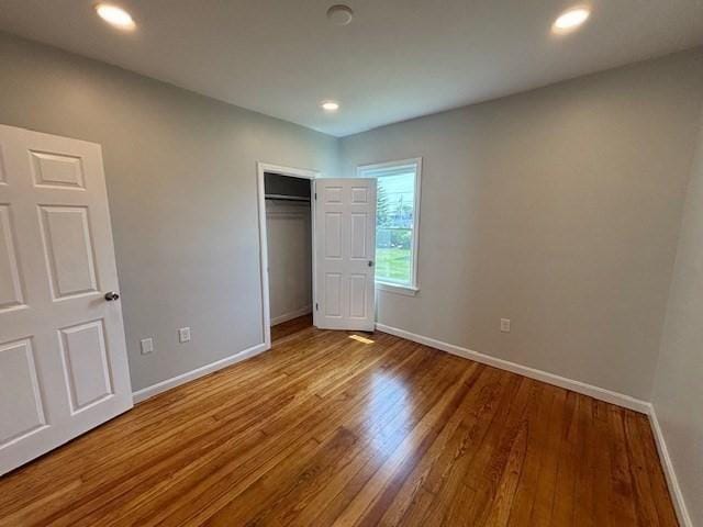 404 Brayton Ave, Fall River, MA 02721 - unfurnished bedroom with wood finished floors, a closet, and recessed lighting