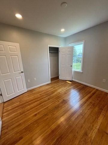 404 Brayton Ave, Fall River, MA 02721 - unfurnished bedroom with wood finished floors, a closet, and recessed lighting