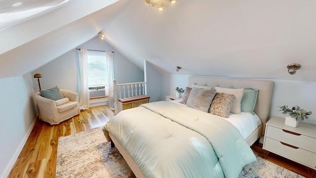 31-33 Harvard St, Medford, MA 02155 - bedroom with vaulted ceiling, wood finished floors, and cooling unit