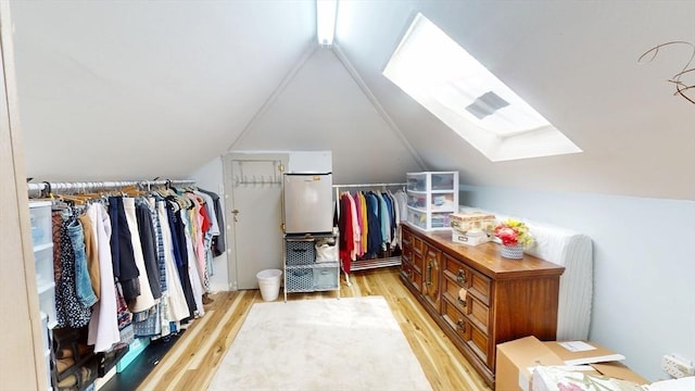 31-33 Harvard St, Medford, MA 02155 - spacious closet featuring light wood-style flooring and vaulted ceiling