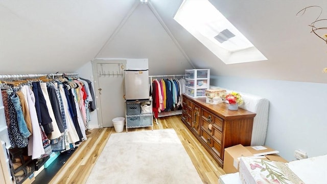 31-33 Harvard St, Medford, MA 02155 - walk in closet with light wood-type flooring, lofted ceiling, and a skylight