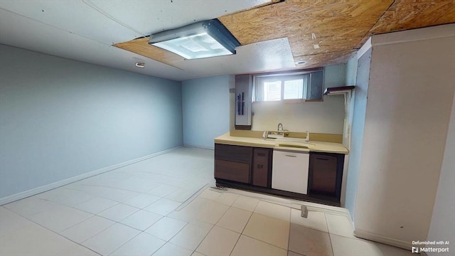 31-33 Harvard St, Medford, MA 02155 - kitchen with light countertops, white dishwasher, and light tile patterned floors