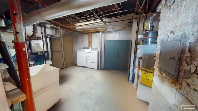 31-33 Harvard St, Medford, MA 02155 - unfinished below grade area with water heater, washing machine and clothes dryer, and electric panel