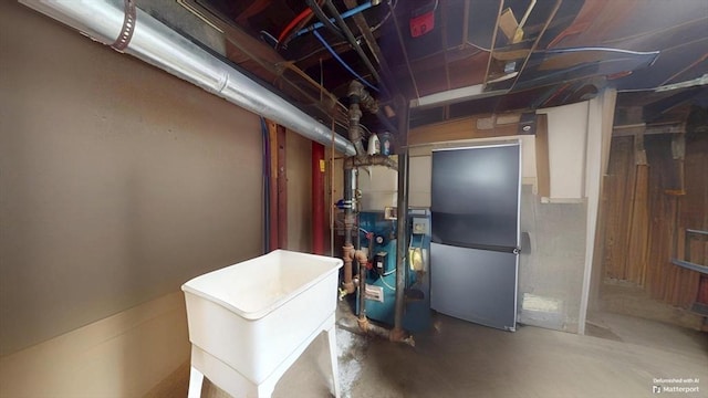 31-33 Harvard St, Medford, MA 02155 - unfinished basement featuring freestanding refrigerator