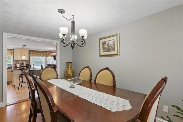 544 Main St, Stoneham, MA 02180 - dining room featuring a chandelier and light wood finished floors