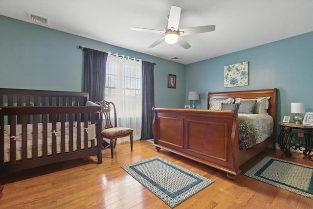 544 Main St, Stoneham, MA 02180 - bedroom with wood finished floors and ceiling fan
