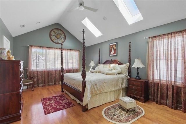 544 Main St, Stoneham, MA 02180 - bedroom featuring a skylight, vaulted ceiling, wood finished floors, and ceiling fan
