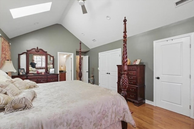544 Main St, Stoneham, MA 02180 - bedroom featuring a skylight, light wood-style flooring, lofted ceiling, a ceiling fan, and a closet