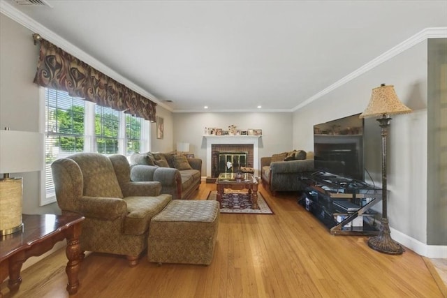 544 Main St, Stoneham, MA 02180 - living area with a brick fireplace, wood finished floors, recessed lighting, and ornamental molding