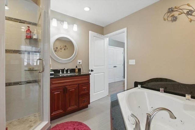 544 Main St, Stoneham, MA 02180 - full bathroom with a stall shower, vanity, a whirlpool tub, and recessed lighting