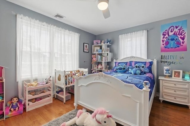 544 Main St, Stoneham, MA 02180 - bedroom with wood finished floors and ceiling fan