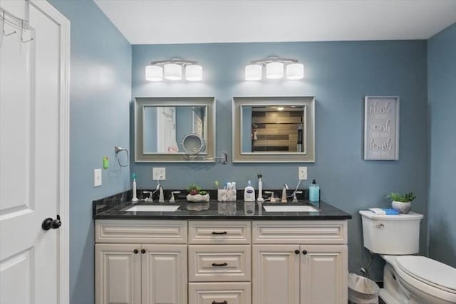 544 Main St, Stoneham, MA 02180 - bathroom featuring double vanity and toilet