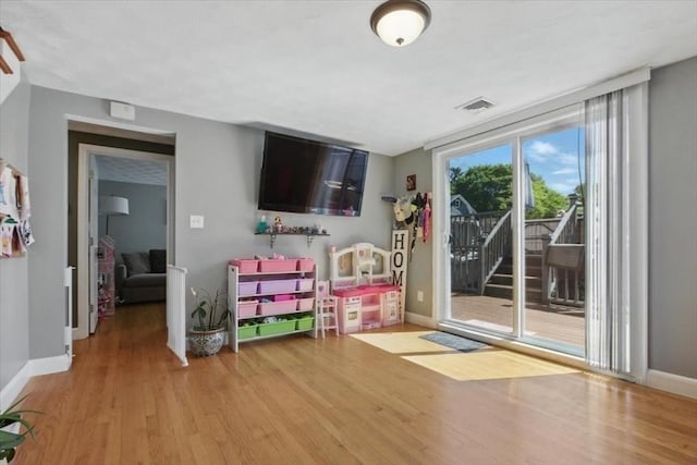 544 Main St, Stoneham, MA 02180 - game room with wood finished floors and baseboards