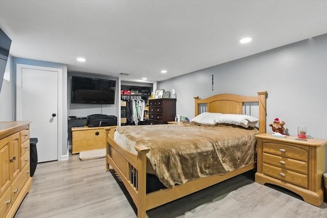 544 Main St, Stoneham, MA 02180 - bedroom featuring light wood-style flooring, recessed lighting, a walk in closet, and a closet