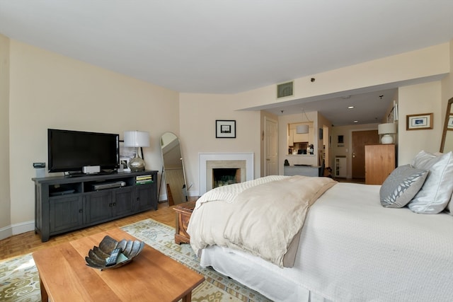 bedroom featuring light hardwood / wood-style floors