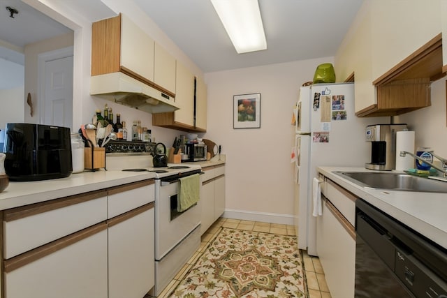 kitchen with white appliances, white cabinetry, light tile patterned floors, and sink