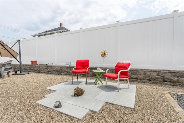 view of patio featuring fence