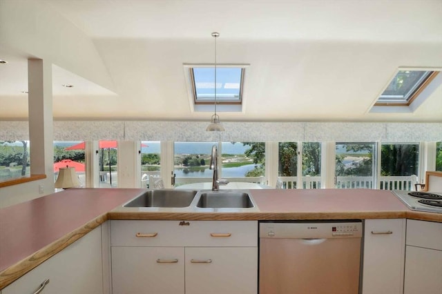 kitchen with dishwasher, sink, white cabinetry, a water view, and a skylight