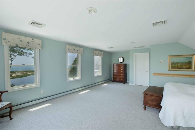 carpeted bedroom with a baseboard heating unit and multiple windows