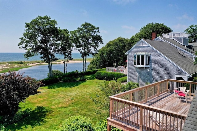 view of yard featuring a deck with water view