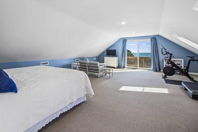 bedroom featuring carpet, lofted ceiling, and access to outside