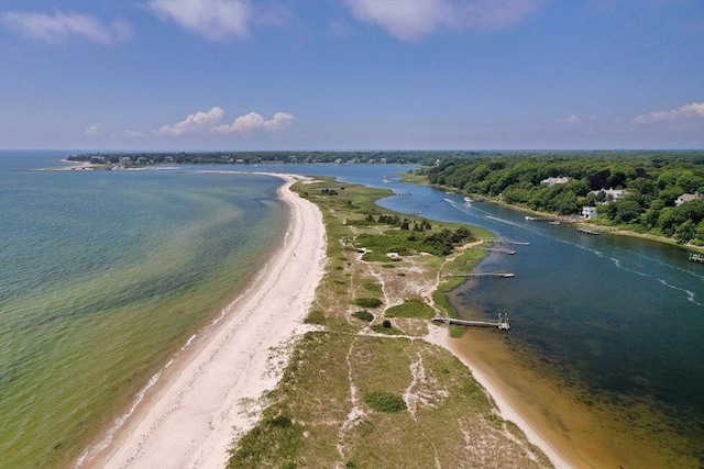 birds eye view of property with a beach view and a water view