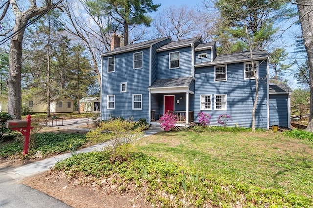 8 Meeting House Hill Rd, Dover, MA 02030 - view of front of property featuring a chimney, a front yard, and a shingled roof