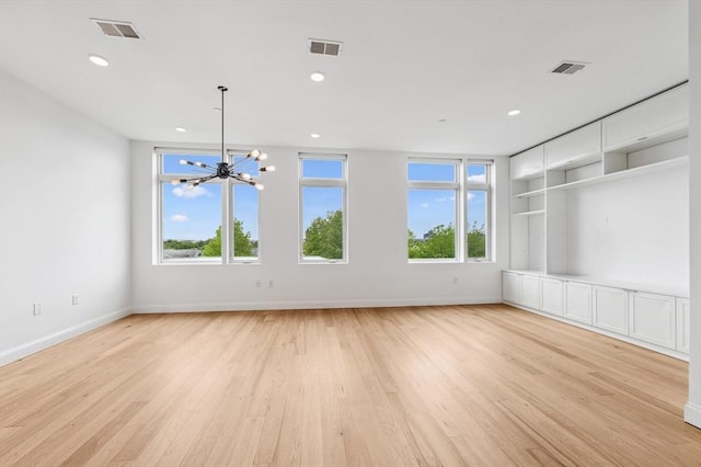 170 W Broadway Unit 403, Boston, MA 02127 - empty room featuring a chandelier, light wood-type flooring, baseboards, and recessed lighting