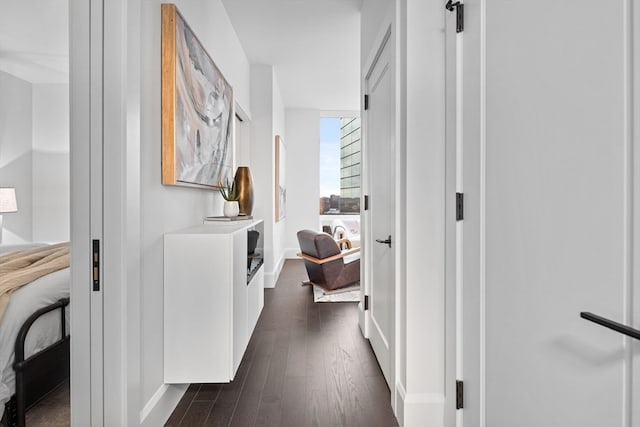 hallway with dark wood-type flooring