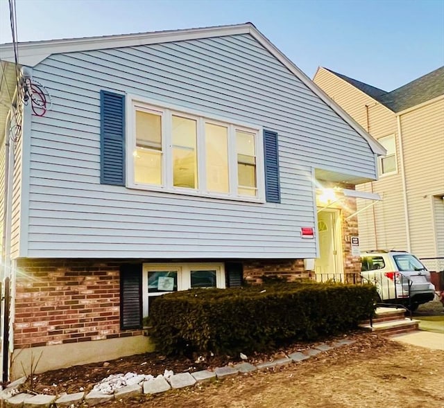 view of home's exterior featuring brick siding