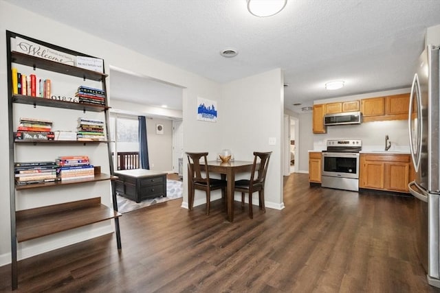 dining room with dark wood-type flooring and sink