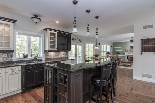 5 Warner Way, Canton, MA 02021 - kitchen with a sink, a center island, dark wood-style floors, decorative backsplash, and open shelves