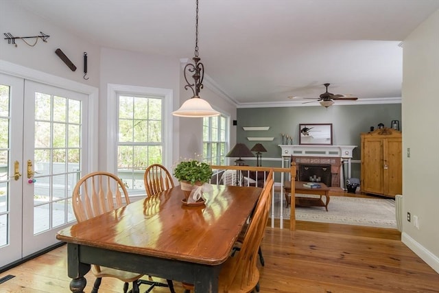 5 Warner Way, Canton, MA 02021 - dining room featuring ceiling fan, light wood-style flooring, french doors, a tile fireplace, and baseboards