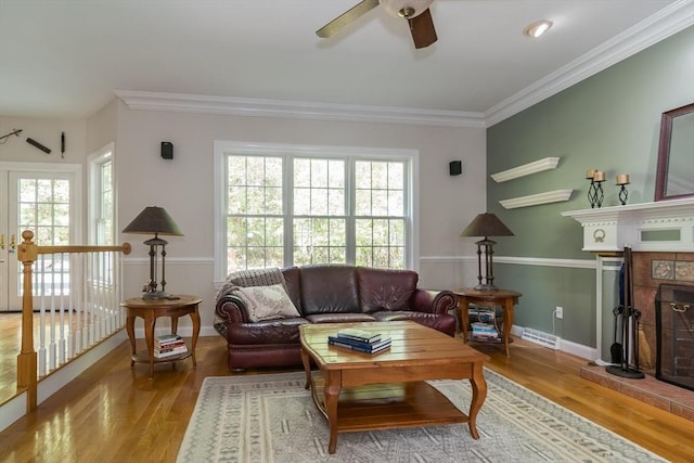 5 Warner Way, Canton, MA 02021 - living room featuring ceiling fan, a brick fireplace, plenty of natural light, wood finished floors, and crown molding