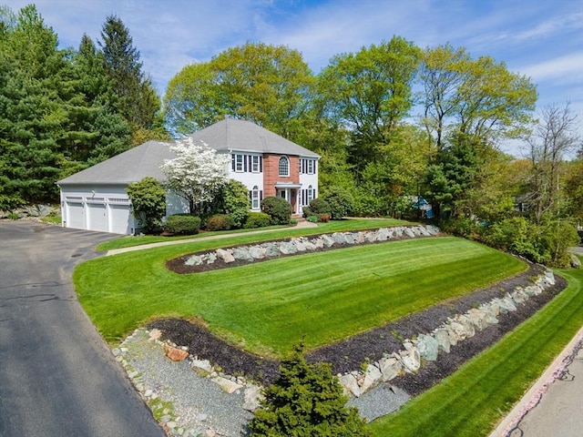 5 Warner Way, Canton, MA 02021 - colonial home with driveway, a front lawn, and an attached garage