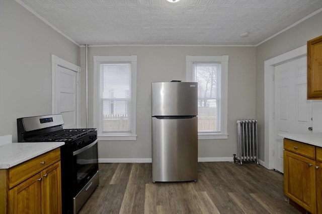 kitchen with crown molding, stainless steel appliances, dark hardwood / wood-style floors, and radiator heating unit