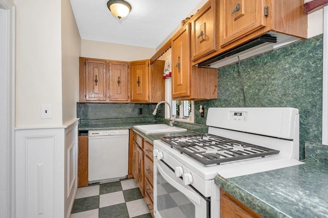 89 Merrill Ave, Lowell, MA 01850 - kitchen featuring white appliances, a sink, brown cabinets, light floors, and backsplash