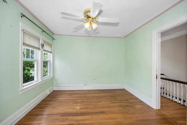 89 Merrill Ave, Lowell, MA 01850 - unfurnished room featuring wood finished floors, ornamental molding, baseboards, and a ceiling fan